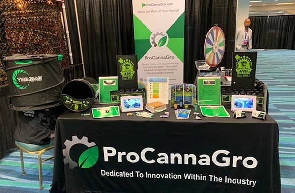 ProCannaGro at a trade convention, showing off our in-house Debudder Bucket Lid.